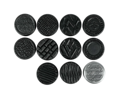 A collection of twelve textured, circular objects, displayed against a stark black background