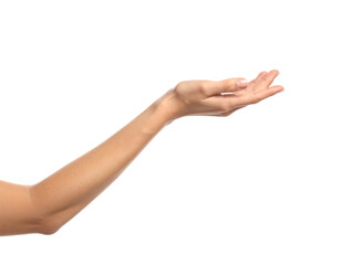 A light-skinned arm extends forward, palm facing upward, on a black background