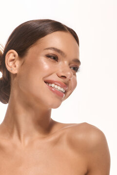 Fototapeta Natural beauty shines in a radiant smile against a clean white backdrop