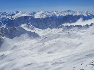 Snow covered mountain top in Austria. View of the Alps from the Zugspitze, the highest mountain in Germany