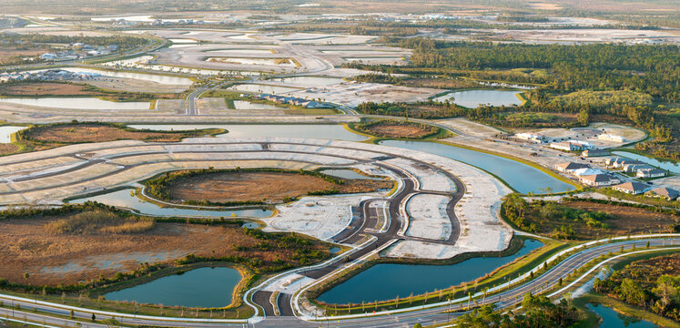 New suburban development area ready for housing construction on prepared soil in Florida suburbs. Real estate market in the USA