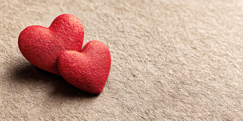 Two Red Glitter Hearts Resting on a Textured Brown Fabric Surface