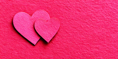 Two Pink Hearts Overlapping on a Vibrant Textured Fuchsia Background