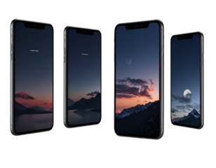 Four sleek, modern smartphones display atmospheric wallpapers of mountains and celestial bodies