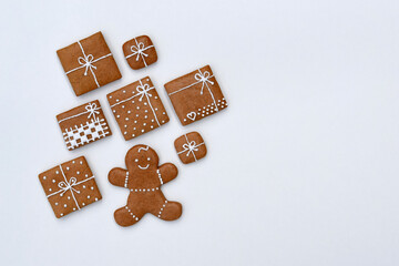 Decorated gingerbread cookies - christmas presents and gingerbread man on a white background, copy space for text