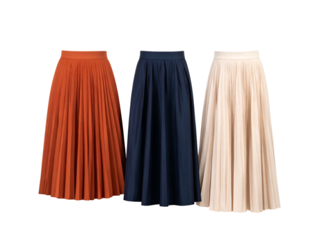Three pleated, flowing skirts in terracotta, navy blue, and cream against a black backdrop