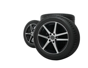 Fototapeta premium Perspective shot of three new car wheels stacked in a diagonal arrangement against a dark backdrop