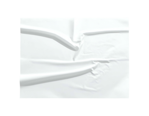 Abstract close-up featuring a folded white fabric surface with deep shadows and highlights