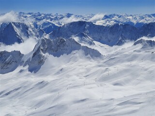 Snow covered mountain top in Austria. View of the Alps from the Zugspitze, the highest mountain in Germany