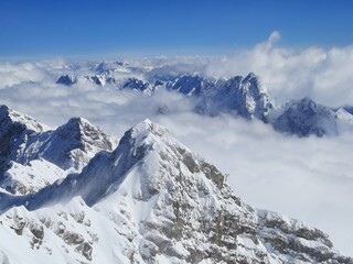 Snow covered mountain top in Austria. View of the Alps from the Zugspitze, the highest mountain in Germany