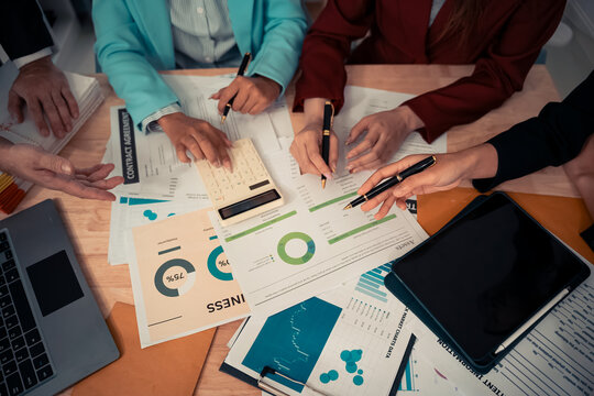 Data analysis meeting with business team using laptops and digital charts for strategic planning. With digital tablets and business graphs with data working in the office.