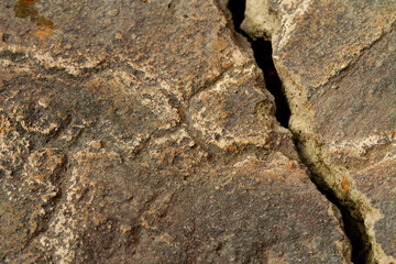 Cracked Stone Surface Texture, Natural Rock Detail with Rough Pattern and Weathered Lines for Background or Design Material