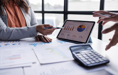 Calculating electronic medical accounts and codes in a black office using a spreadsheet on a computer screen.

