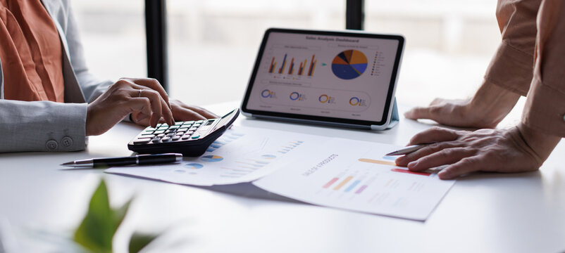 Calculating electronic medical accounts and codes in a black office using a spreadsheet on a computer screen.

 - Powered by Adobe