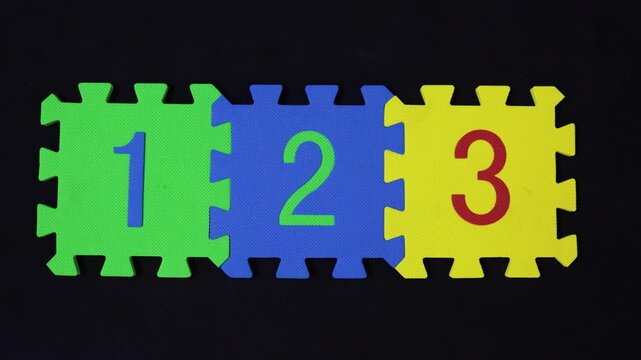 education and learning numbers 1 2 3 on colorful puzzle pieces