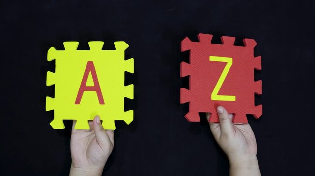 alphabet learning concept beginning A and end Z blocks on black background