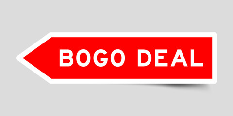 Red color arrow shape sticker label with word bogo deal on gray background