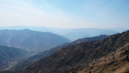 Majestic mountain range panorama under a clear blue sky. Media