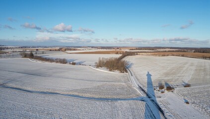 Bird's-Eye Perspective of Frost-Covered Farmland. Seasonal Agricultural Scenery.