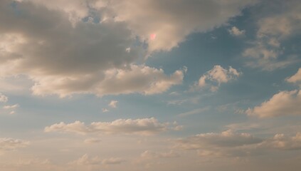 Graphic design backdrop featuring a bright blue sky with fluffy white clouds