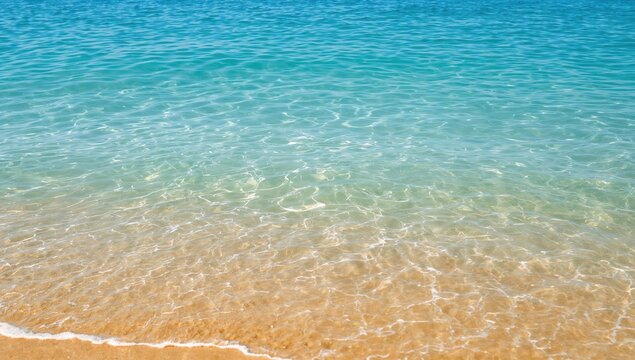 Transparent and salty blue sea surface with sandy reflections