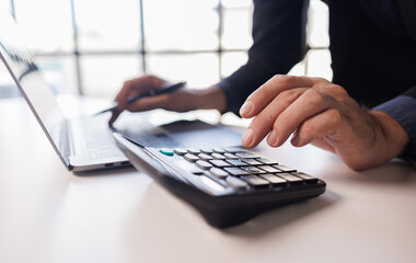 Accountant man hang using calculator to calculate company finances at office. Bookkeeper inspector...
