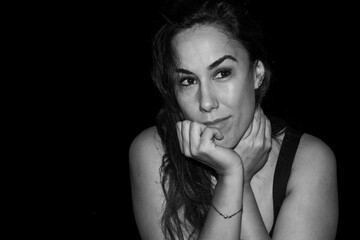 Woman thinking looking away with contemplative expression