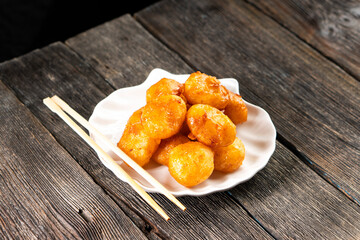 Pineapple pieces fried in caramel.Dessert. Food concept