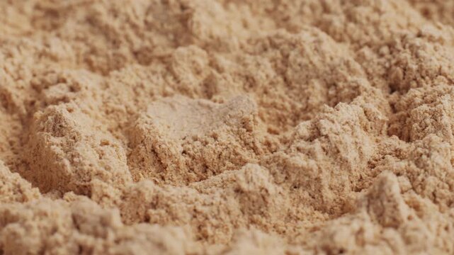 Ashwagandha Indian Ginseng Powder in White Bowl isolated on white background, superfood close up. 