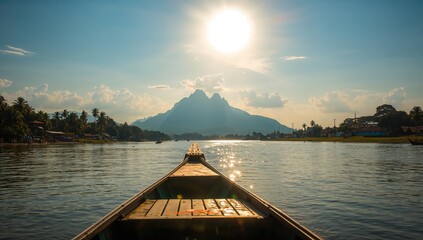 Fototapeta premium Scenic boat journey showcasing mountains along the central river to a historic town