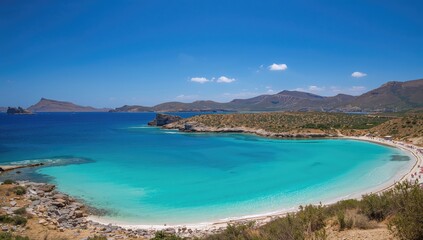Obraz premium Stunning turquoise waters at a beautiful beach near a famous island in the Mediterranean.
