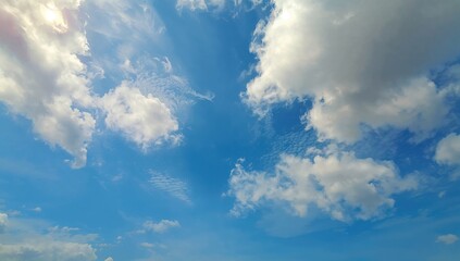 Obraz premium Afternoon Clouds Beneath a Clear Blue Sky