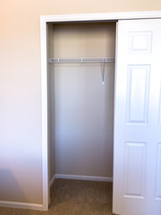Open Closet Interior with White Doors
