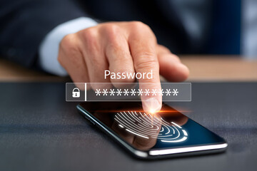Businessman using fingerprint scan for smartphone password and secure access.