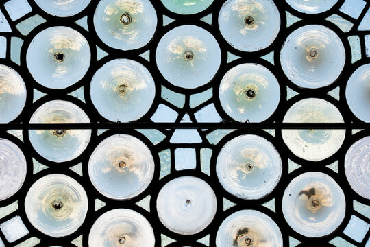 Antique bullseye stained glass window pattern
