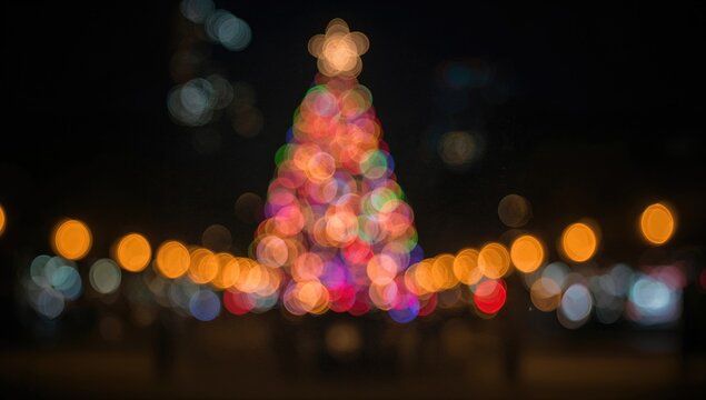 Abstract glowing bokeh pattern with circular light spots on dark background