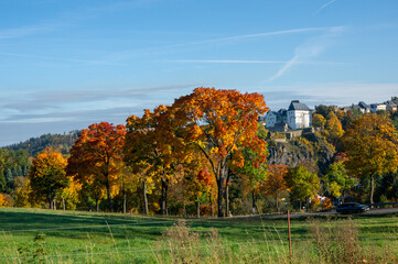 Obraz premium autumn landscape with trees an castle wolkenstein in the Erzgebirge, Saxony Germany