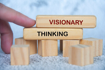 Wooden blocks showing VISIONARY THINKING text for creativity and innovation.