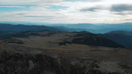 Dramatic aerial view of a vast mountain range landscape. Media