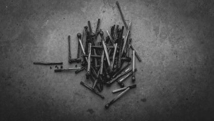 Charred matchsticks against a muted background, grayscale image, fatigue