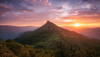 Obraz premium Romantic sunset illuminating vast fields and mountain landscape