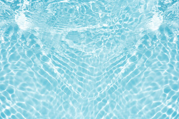 Blue water with ripples on the surface. Defocus blurred transparent blue colored clear calm water...