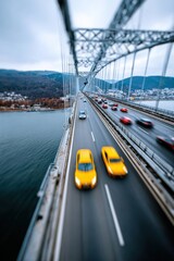 Cars cross a bridge over a river in a cloudy atmosphere with distant hills in the background during the day