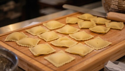 Freshly made pasta displayed on a wooden surface in a culinary environment, ideal for dining establishments or home chefs.