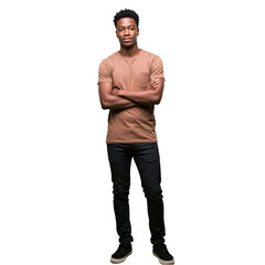Naklejka premium A young african american man standing with arms crossed in a brown shirt and dark jeans on black background on transparent background