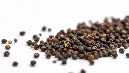 Black peppercorns isolated on a plain white surface, culinary and medicinal use