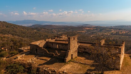 Bird's-eye perspective of ancient castle ruins in a small municipality near a major city in Spain