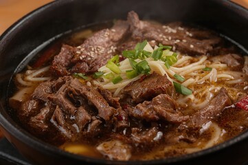 Fototapeta premium Detailed view of a bowl of beef noodle soup