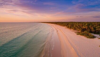 Fototapeta premium Sunset aerial perspective of a coastal stretch with white sandy shores