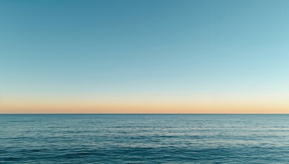 Obraz premium Tranquil ocean beneath a clear azure sky